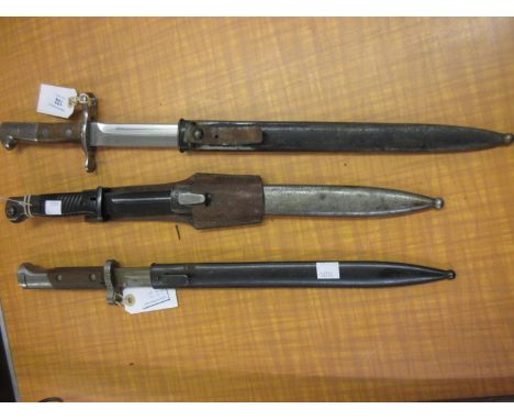 Elsener Schwyz Swiss World War I bayonet with scabbard, together with a German Horster bayonet with scabbard and another Germ