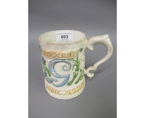 Unusual Compton pottery mug to commemorate the Coronation of King George V, the tapering body decorated in painted relief wit