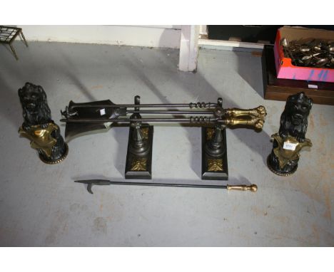 Good quality 19th Century French cast iron and brass fire set, the two ends in the form of lions together with a set of three