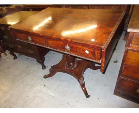 Regency figured mahogany and crossbanded drop-leaf sofa table with two drawers and brass ring handles above a turned and flut