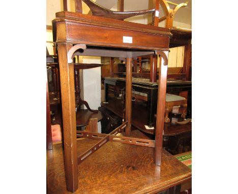 Pair of reproduction mahogany lamp tables, the galleried tops above square cut chamfered supports with pierced crossover stre