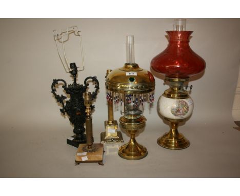 Small brass oil lamp with brass and tasselled shade decorated with jewelling, a dark patinated vase adapted for use as a tabl