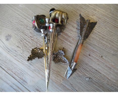 Collection of stick pins to include an elephant and owls head 