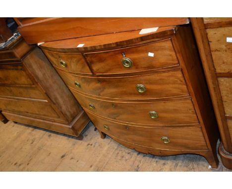 Small 19th Century mahogany bow front chest of two short and three long drawers with circular brass handles and splay bracket