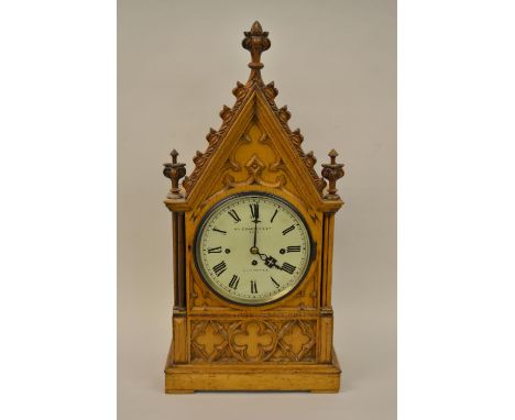Victorian pale oak bracket clock of Gothic Revival design, the painted dial with Roman numerals, signed William Roskell and C