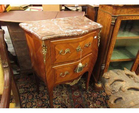 20th Century French kingwood and parquetry inlaid ormolu mounted commode with a rouge marble top above two drawers raised on 