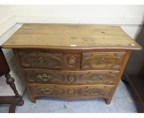 18th Century French provincial oak commode, the moulded top above two short and two long drawers with ormolu handlesSome area
