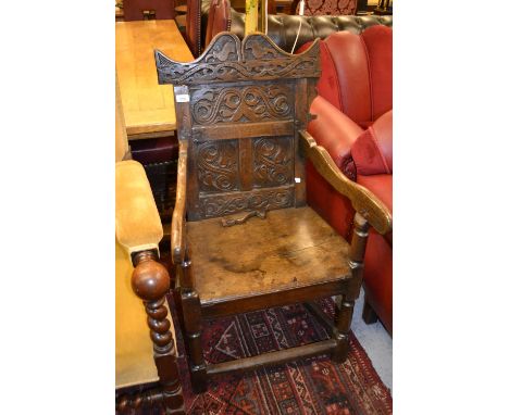 17th Century oak Wainscot chair with carved panel back, panel seat and turned front supports (with damages) 