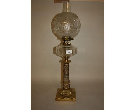 Good quality Victorian brass oil lamp, the glass well above a square tapering column support decorated in relief with phoenix