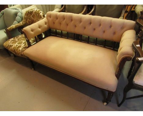 Small late Victorian walnut and button upholstered sofa with turned spindle back and turned front supports 