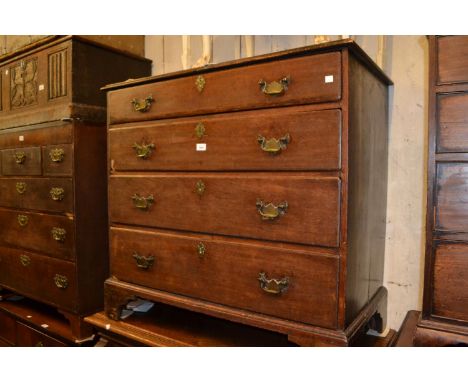 Mid 18th Century oak chest, the moulded top above four graduated drawers with brass swan neck handles and escutcheons on brac