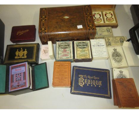 19th Century dome top walnut inlaid games/card box with cribbage, bezique marker and a set of De la Rue & Co. playing cards, 