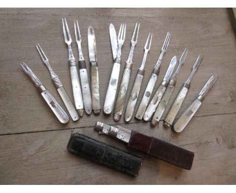 Cased silver and mother of pearl handled folding fruit knife and fork, a similar fruit knife and fork pair, cased, three silv