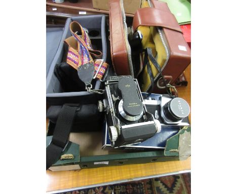 Mamiyaflex twin lens camera with accessories in a fitted case, together with a Pentax Spotmatic 35mm camera with additional l
