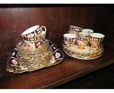 Royal Crown Derby Imari pattern six place setting tea service with cream jug and sugar bowl, together with five various simil