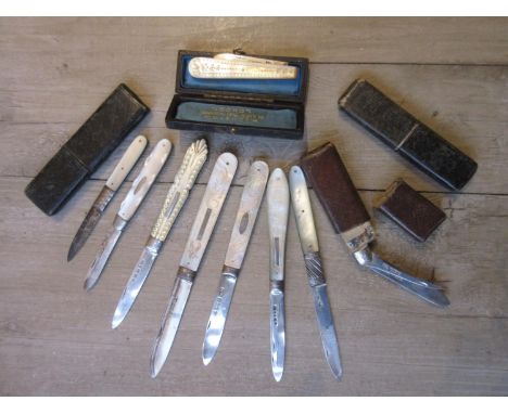 Two silver and mother of pearl handled folding fruit knives with double blades, one with case, together with three silver and