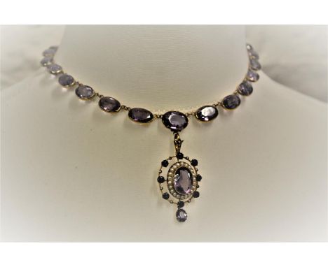 Victorian 9ct Gold riviere necklace set with twenty seven oval graduated cut amethyst in collet setting with an oval amethyst
