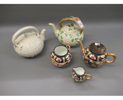 Two 19th Century Belleek teapots with black marks, together with a Davenport Imari pattern three piece tea service with silve