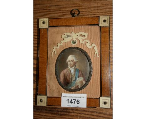 Continental oval miniature watercolour portrait of a gentleman wearing a blue sash reading from a letter 