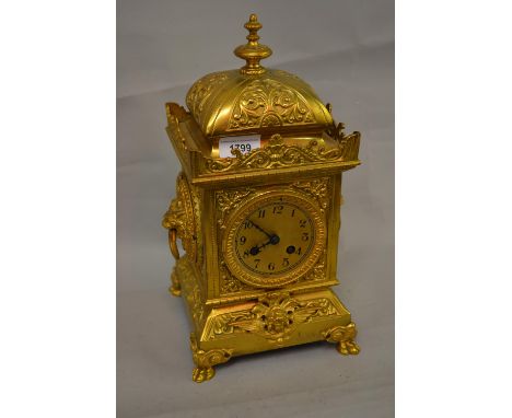 Early 20th Century gilt brass mantel clock having circular gilt metal dial with Arabic numerals and two train movement striki