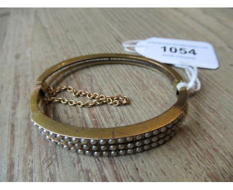 Victorian yellow metal bangle set three rows of split pearls (at fault) 