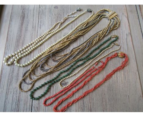 Christian Dior gilt metal necklace, two coral necklaces, a hardstone necklace and three simulated pearl necklaces 