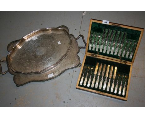 Walnut cased set of twelve silver plated and mother of pearl handled dessert knives and forks, together with two silver plate