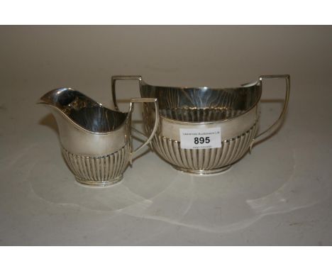 Sheffield silver cream jug and sugar basin of oval half fluted design 