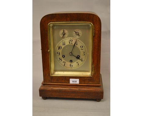 Early 20th Century oak mantel clock with a silvered dial, subsidiary chime / silent selector and advance / retard selector, A
