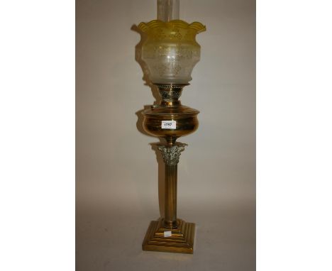 Victorian brass Corinthian column oil lamp with glass shade and chimneyMinor chip to rim, larger chip to foot as shown in pho