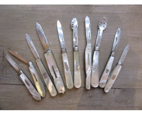 Two unusual Sheffield silver double bladed fruit knives with spoons, three mother of pearl mounted silver and steel multi bla