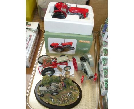 A boxed as new Universal Hobbies model of a Massey Ferguson MF65, two other diecast model tractors including 1927 Fordson tra
