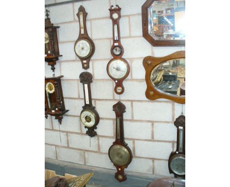 A 19th Century mahogany banjo wall barometer with a silvered dial and a second similar barometer (a/f )  (2)