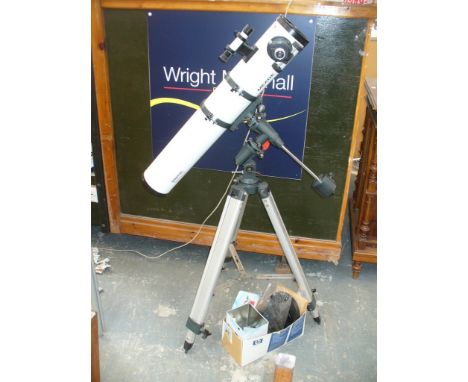 A Meade digital electronic auto locator telescope and tripod.