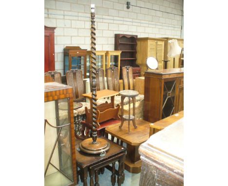 An Art deco oak pedestal centre table, carved plant stand, oak barley twist lamp standard and nest of three oak tables.