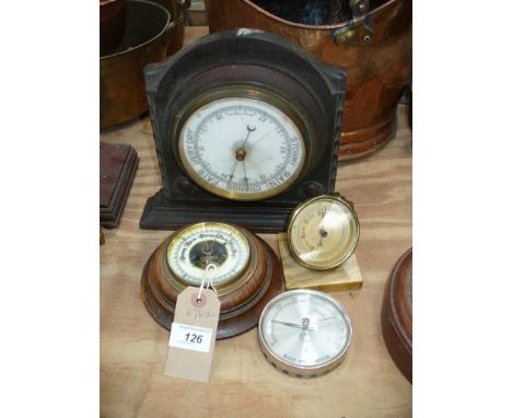 Four assorted barometers including an oak cased wall barometer.