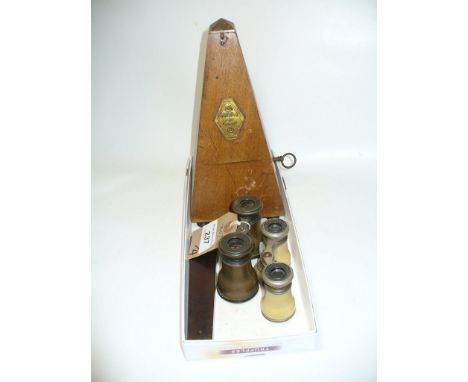 A Cased French metronome, two pairs of opera glasses and a mahogany cased jewelers scales.