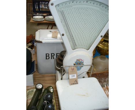 An Enamelled bread bin and cover and a set of Berkell auto shop scales complete with nest weights.