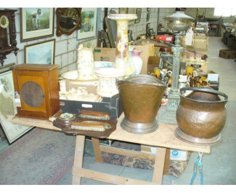 A Stained wooden wall cabinet, hanging brush and barometer set, two copper coal helmets and a Victorian brass Corinthian colu