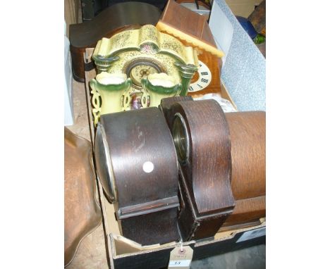 A Collection of clocks including oak cased mantel clocks, ceramic clock garniture, a Russian Vega cuckoo clock, etc.