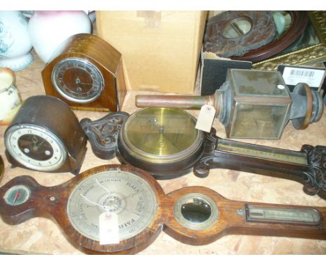 A 19th Century mahogany banjo wall barometer, a Victorian carved oak wall barometer, two oak cased mantel clocks and a 19th C