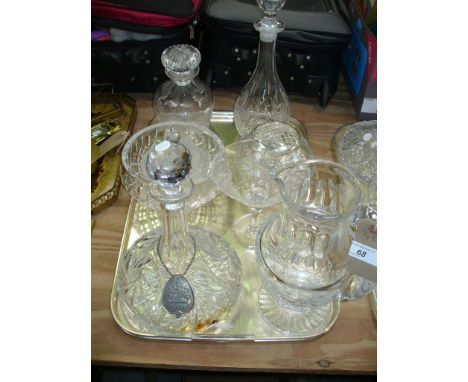 A Cut glass bottle shaped decanter, cut glass ships decanter, a rose bowl, water jug and 3 other items. (7)