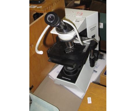 Olympus CH30 biological microscope and instruction manual.