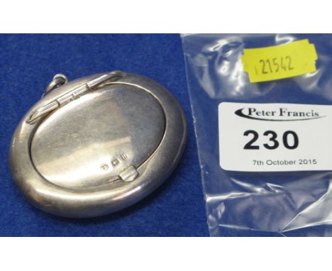 Silver oval cushion shaped compact.