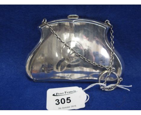 Engine turned silver baluster shape ladies purse with chain suspension.  Birmingham hall mark.