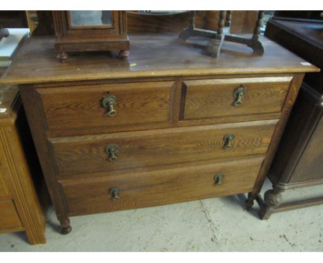 Early 20th century oak barley twist straight front chest of two short and two long drawers on ring turned legs and casters.