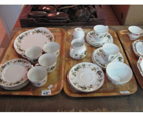 Two trays of Royal Doulton Larchmont design part tea ware items comprising tea cups; saucers; milk jugs; sucrier; plates etc.