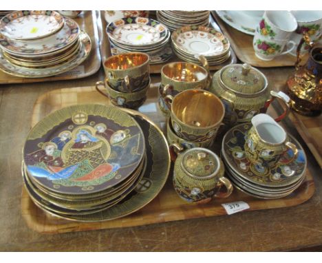 Tray of Japanese Samurai china tea ware items decorated with gilt figures comprising cups, saucers, tea pot, milk jug, sucrie