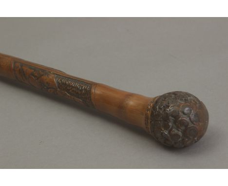 A 20th century Chinese walking stick. Carved bamboo shaft with different characters and handle carved in the shape of ruyi cl