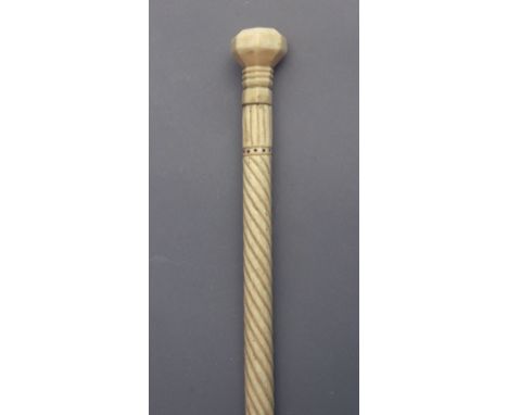 A 19th century walking stick. Carved ivory shaft and handle with ebony inlays, 88,50 cm. long. Elephant and hippo ivory speci